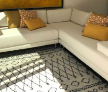 RE-COVERING White corner sofa